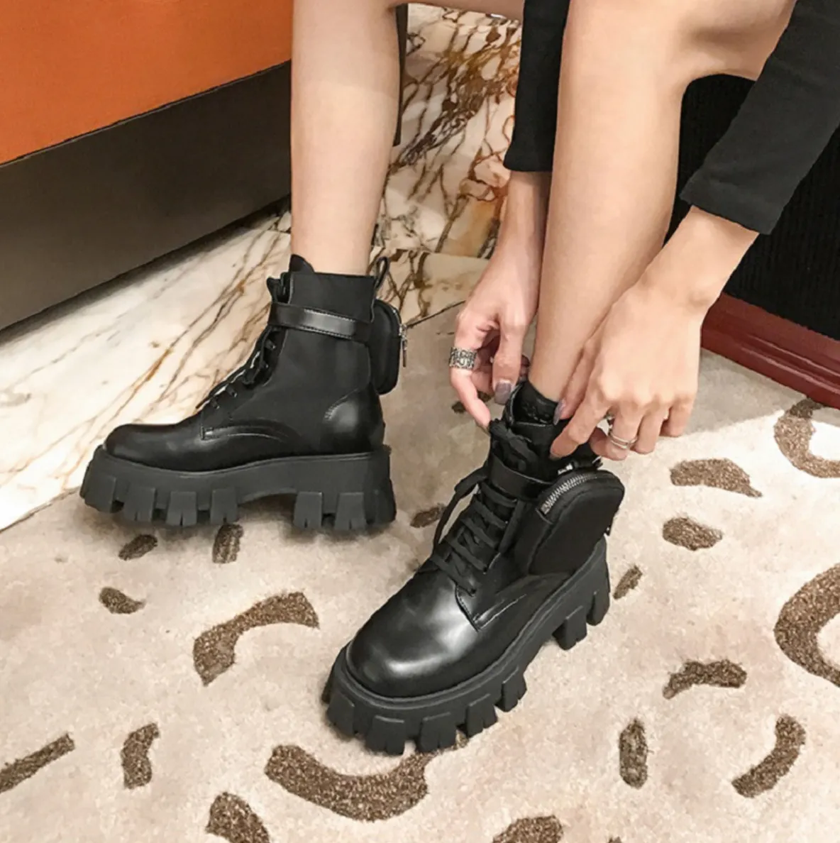 black combat boots with side pockets