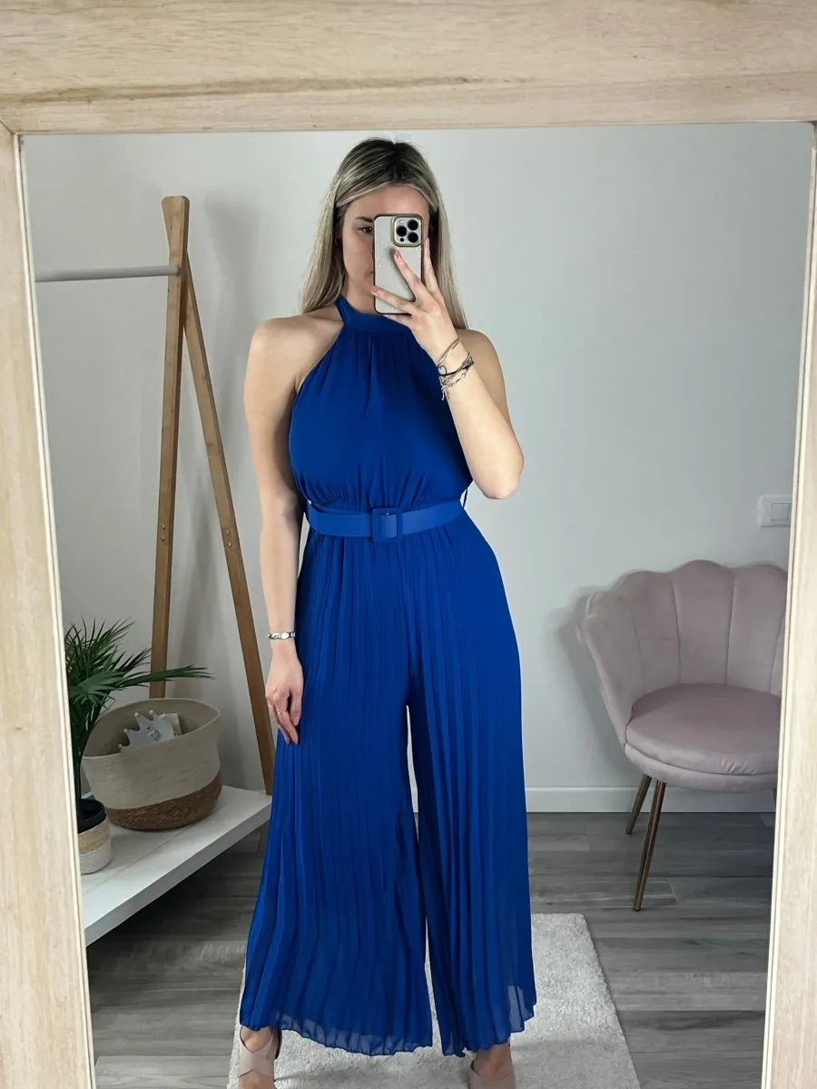 Blue pleated jumpsuit with tulle details.